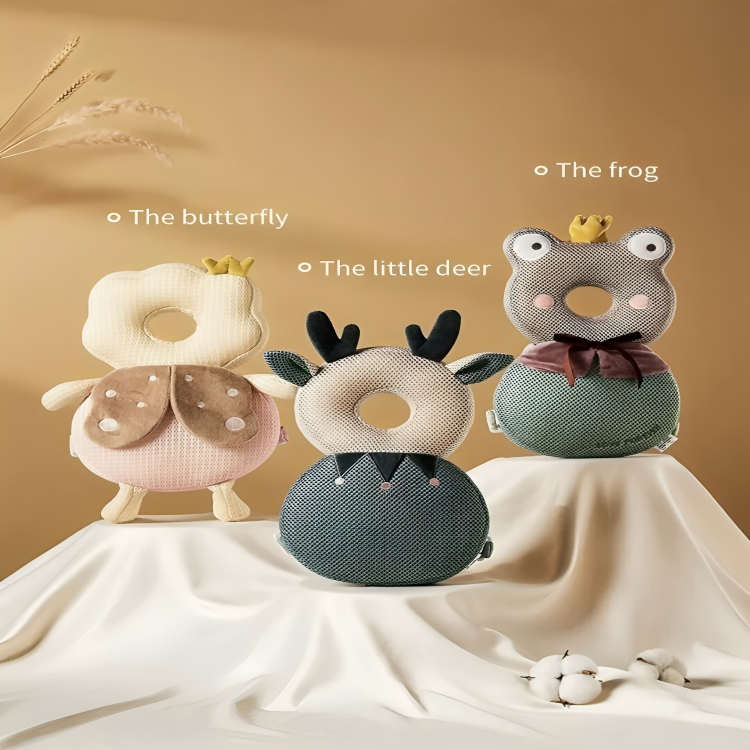 Three animal-themed baby head support pillows on a beige background