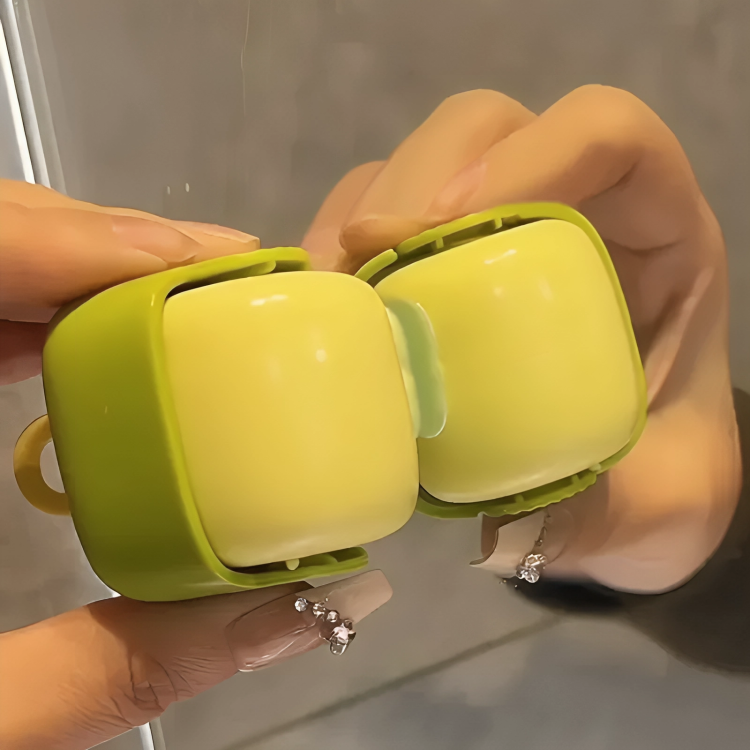 Green and white portable device held by a person with a neutral background