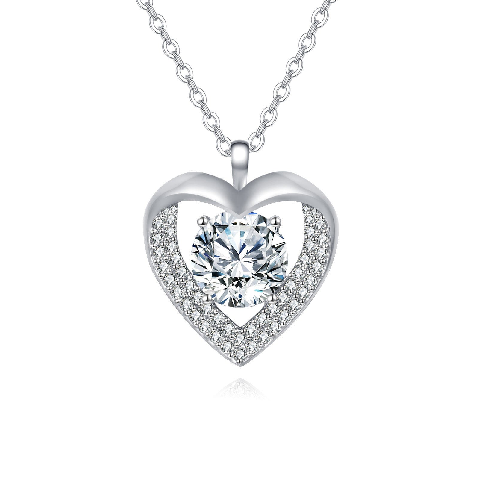 Heart-shaped silver necklace with a central gemstone on a white background