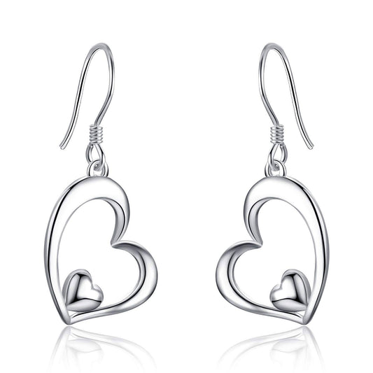 Silver heart-shaped earrings on a white background