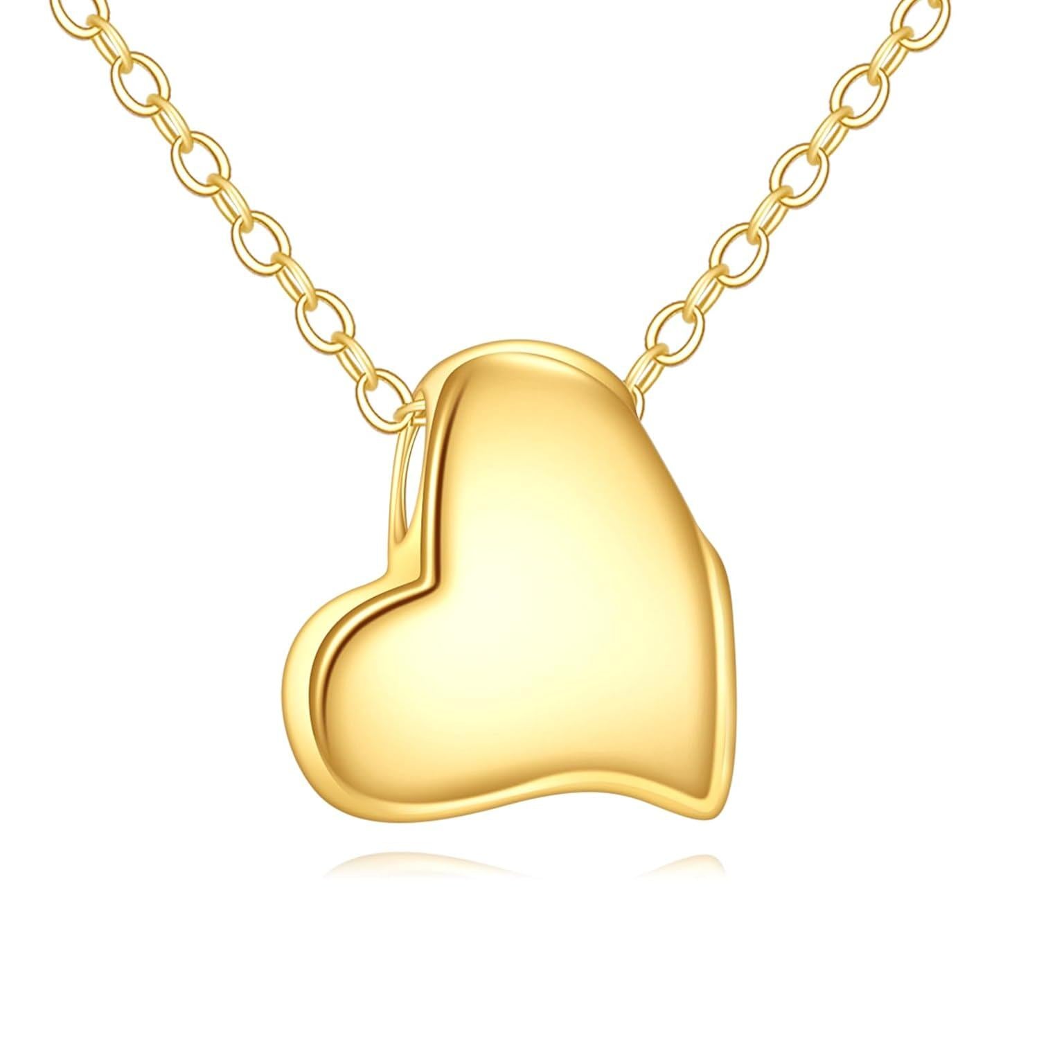 Gold heart-shaped pendant on a gold chain against a white background