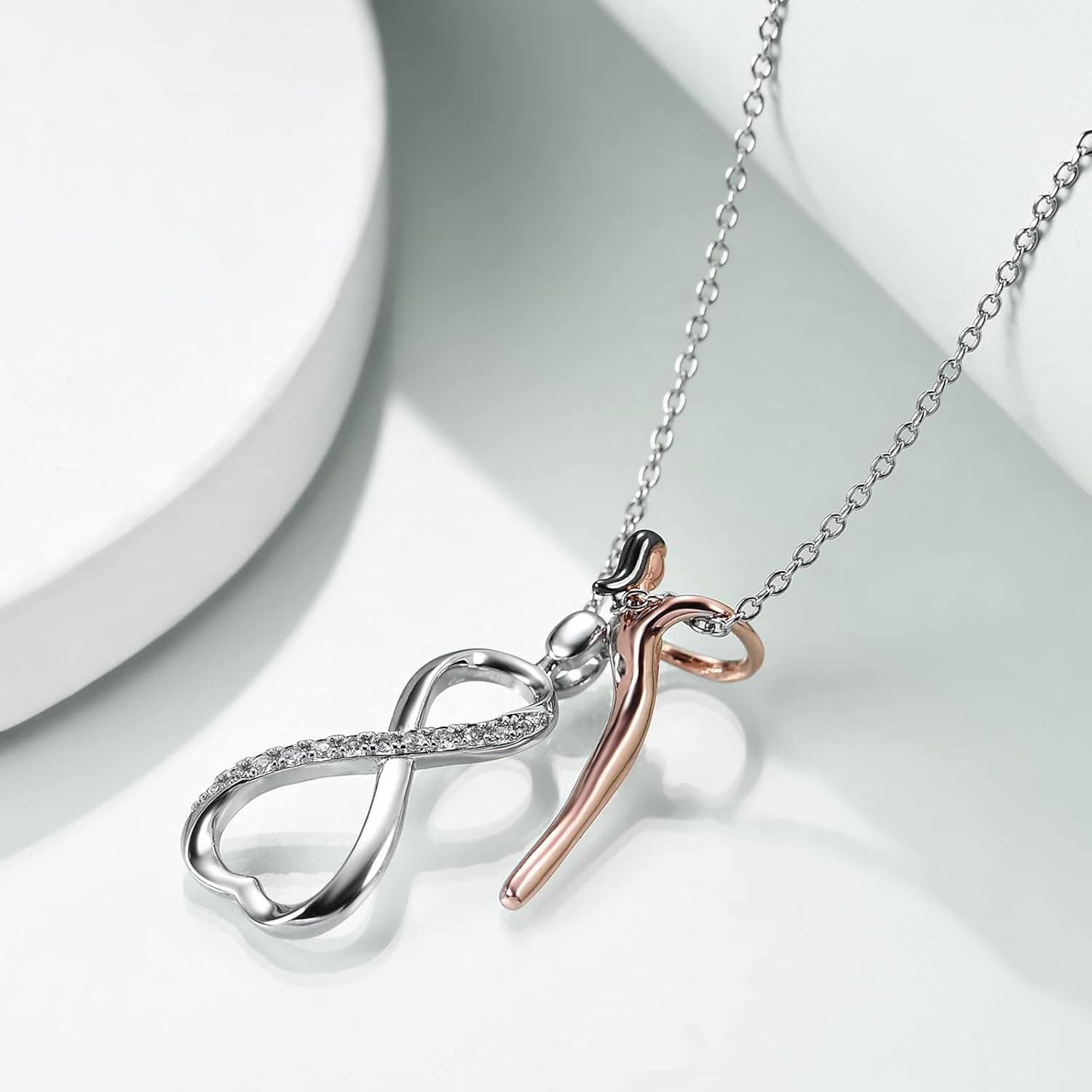 Necklace with infinity symbol pendant on a light background