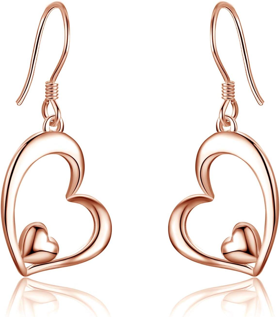 Rose gold heart-shaped earrings on a white background