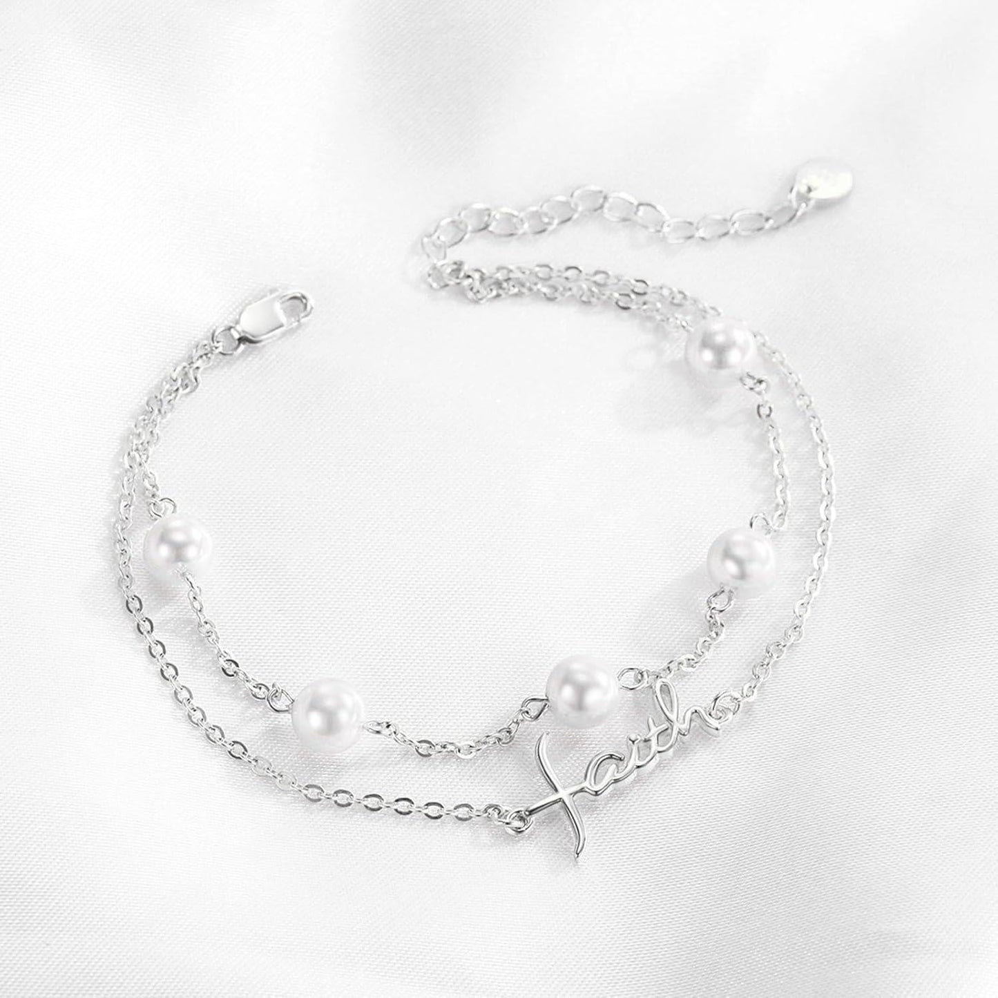 Silver bracelet with pearls on a white background