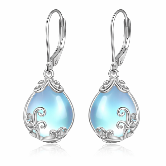 Teardrop-shaped earrings with blue opalite stones and silver filigree on a white background