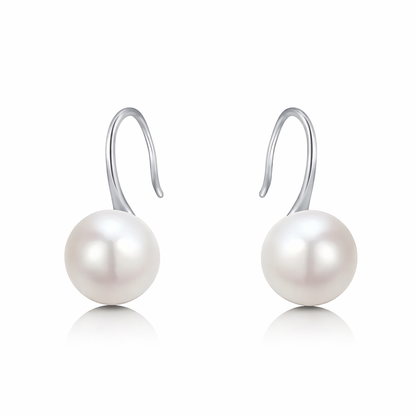 Pearl earrings with silver hooks on a white background