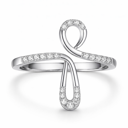 Silver ring with diamond accents on a white background