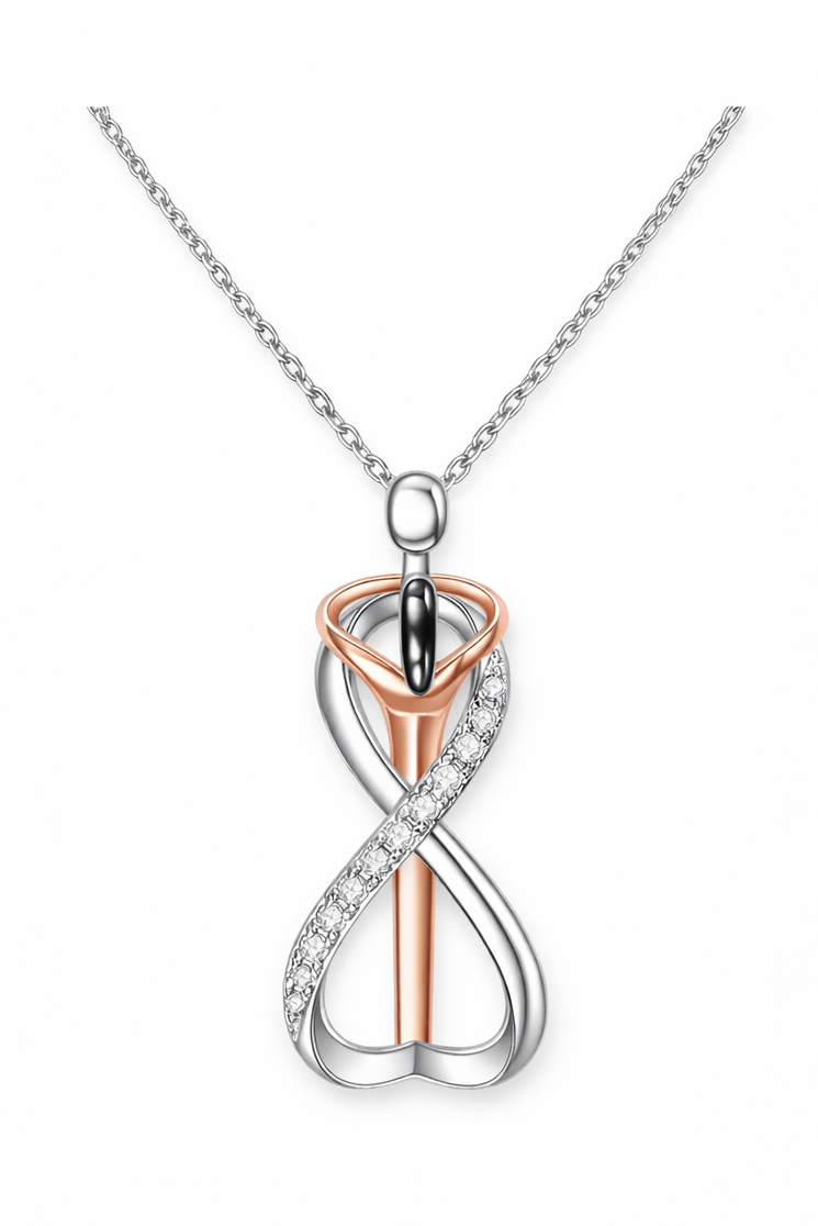 Two-tone infinity pendant necklace on a white background