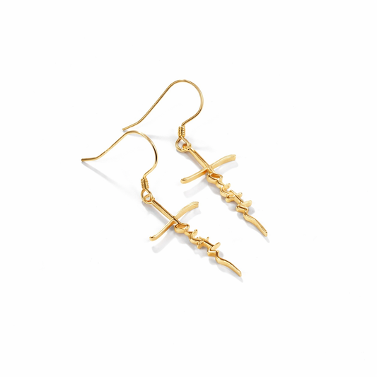 Gold earrings on a white background