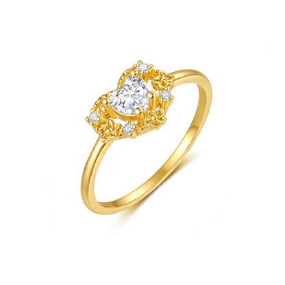 Gold ring with a diamond on a white background