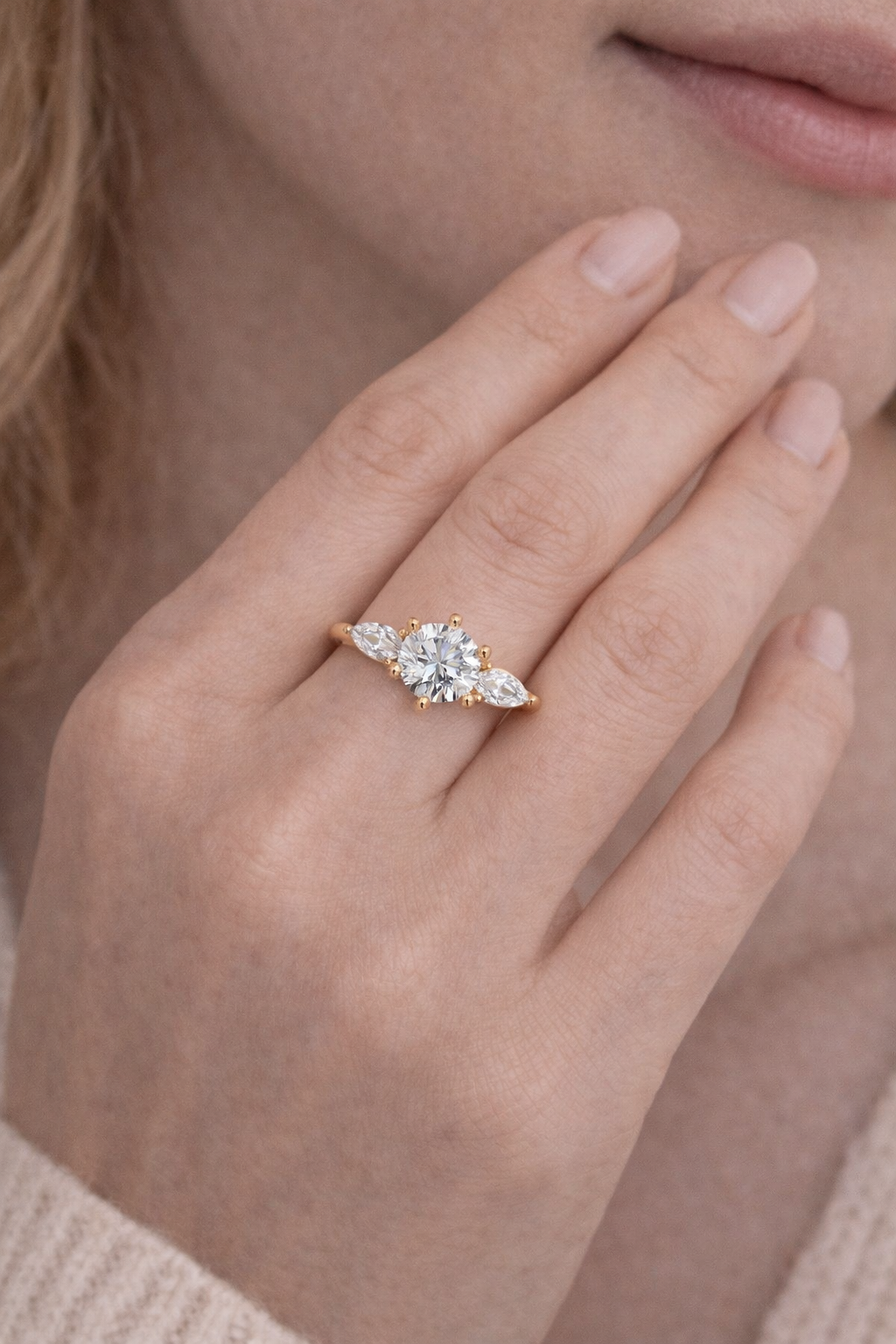 Close-up of a hand wearing a ring with a soft focus background