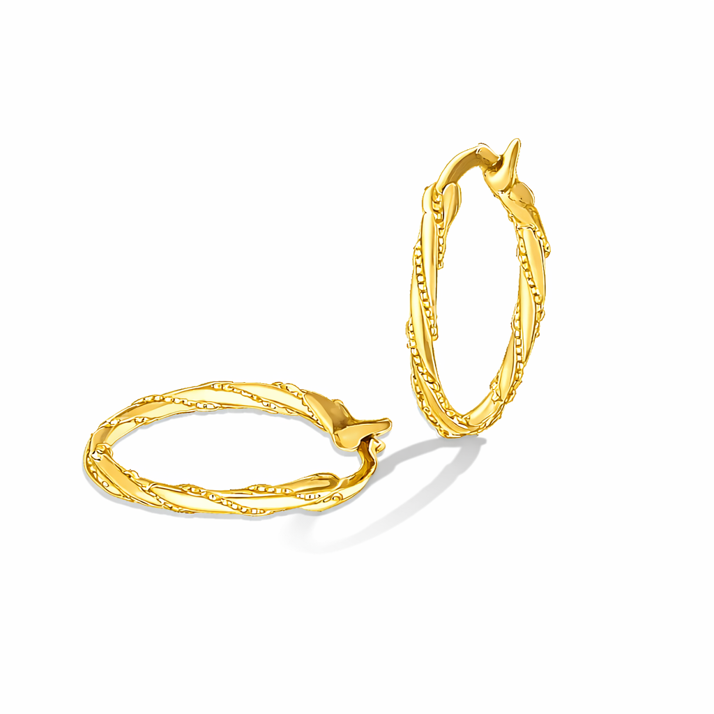 Gold hoop earrings on a white background