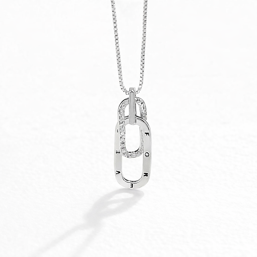 Silver necklace with a pendant on a white background