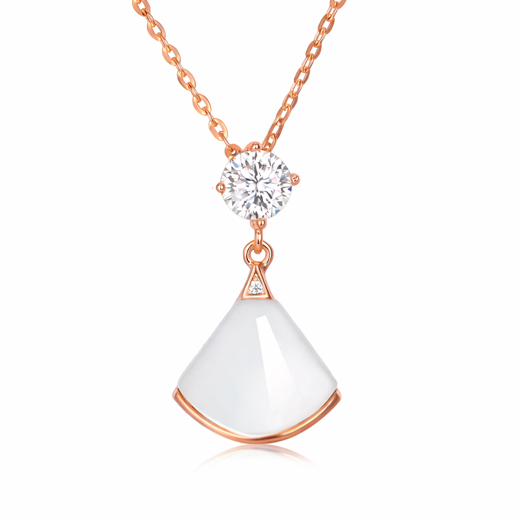 Rose gold necklace with a white pendant on a white background