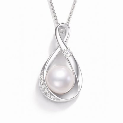 Silver pendant with a pearl on a white background