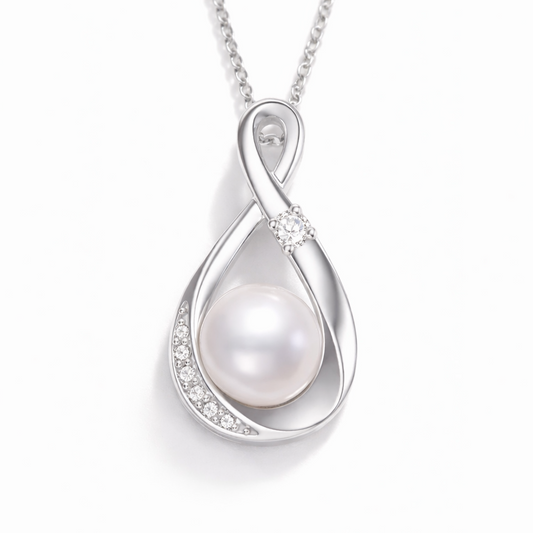 Silver pendant with a pearl on a white background