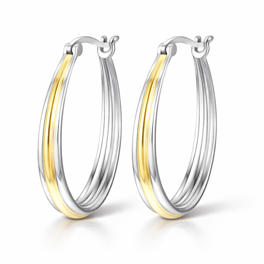 Two-tone silver and gold hoop earrings on a white background