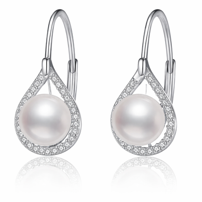 Pearl earrings with silver hooks on a white background