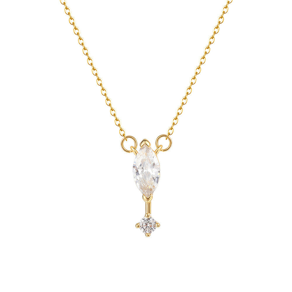 Gold necklace with a diamond pendant on a white background
