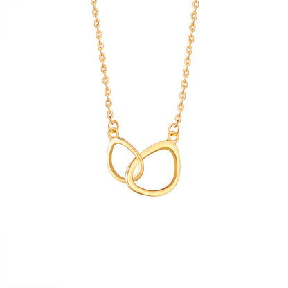 Gold necklace with a double interlocking ring pendant on a white background