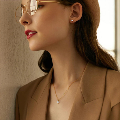 Woman wearing a brown hat and coat, with a neutral background