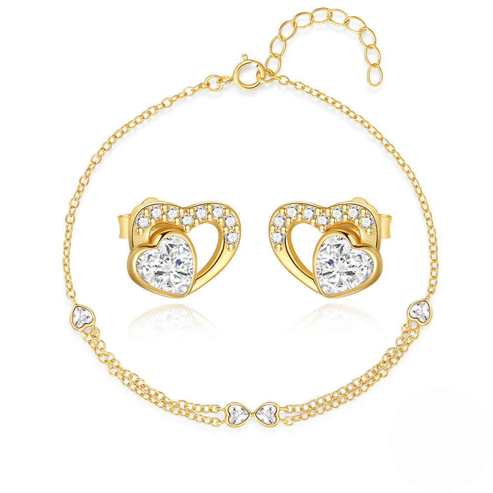 Gold heart-shaped earrings and bracelet set on a white background