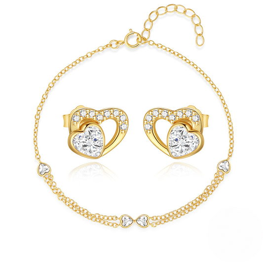Gold heart-shaped earrings and bracelet set on a white background
