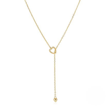 Gold necklace with heart pendants on a white background