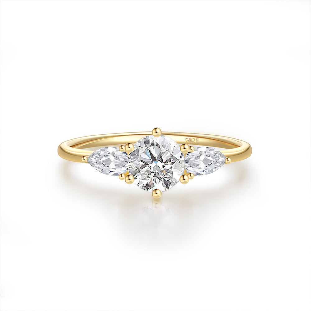 Gold ring with a diamond on a white background
