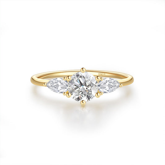 Gold ring with a diamond on a white background