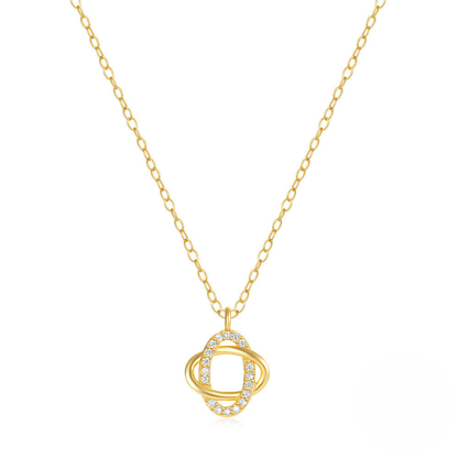 Gold necklace with a circular pendant on a white background