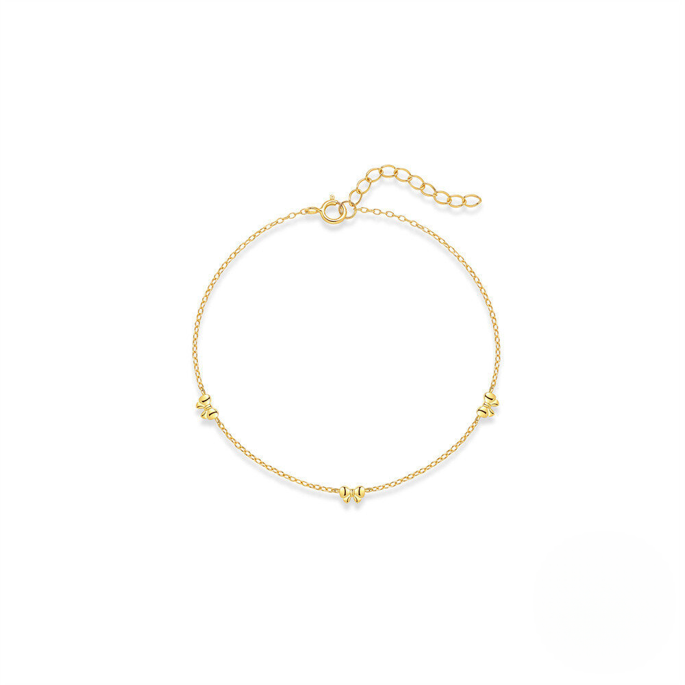 Gold bracelet with small beads on a white background