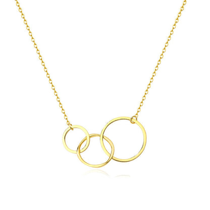 Gold necklace with three interlocking rings on a white background