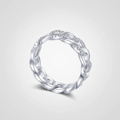 Silver ring with intricate design on a light gray background