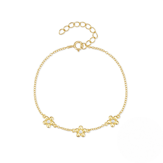 Gold bracelet with floral designs on a white background