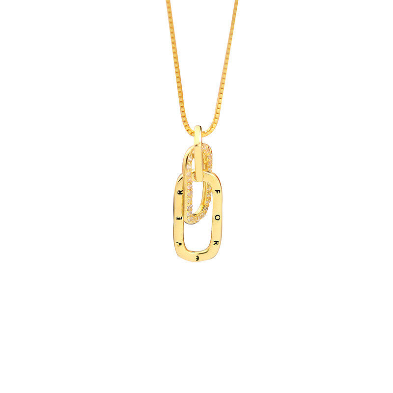 Gold necklace with a unique pendant on a white background