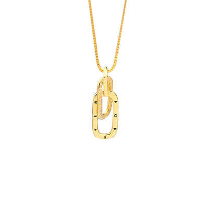 Gold necklace with a unique pendant on a white background