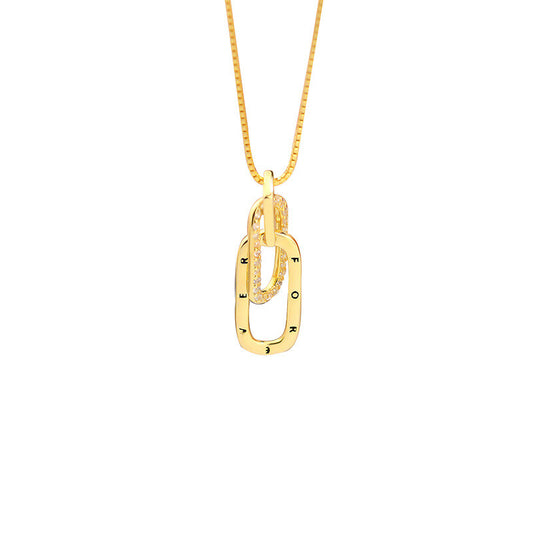 Gold necklace with a unique pendant on a white background