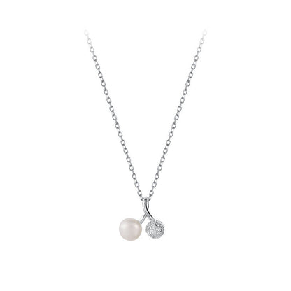 Necklace with a pearl and small diamond pendant on a white background