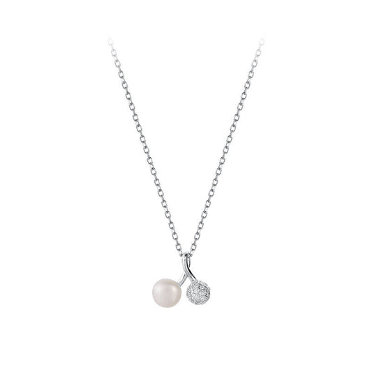 Necklace with a pearl and small diamond pendant on a white background