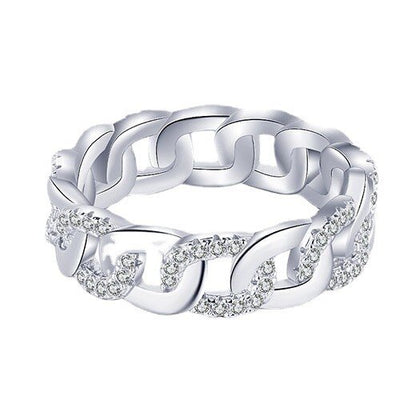 Silver chain ring with diamond accents on a white background