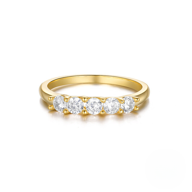 Gold ring with four diamonds on a white background
