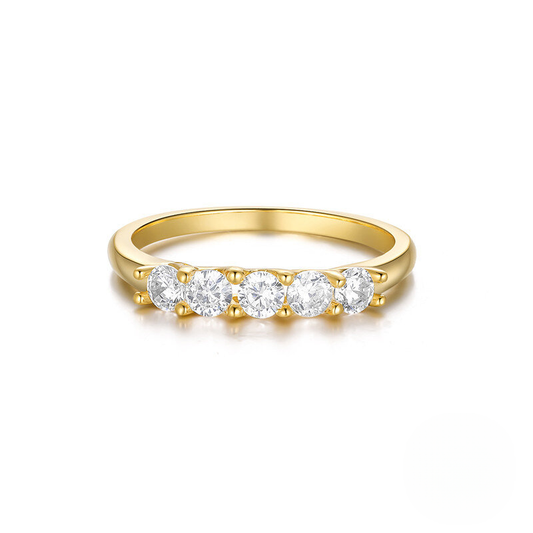 Gold ring with four diamonds on a white background