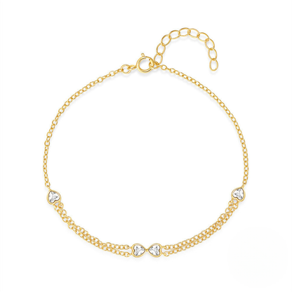 Gold bracelet with heart-shaped charms on a white background