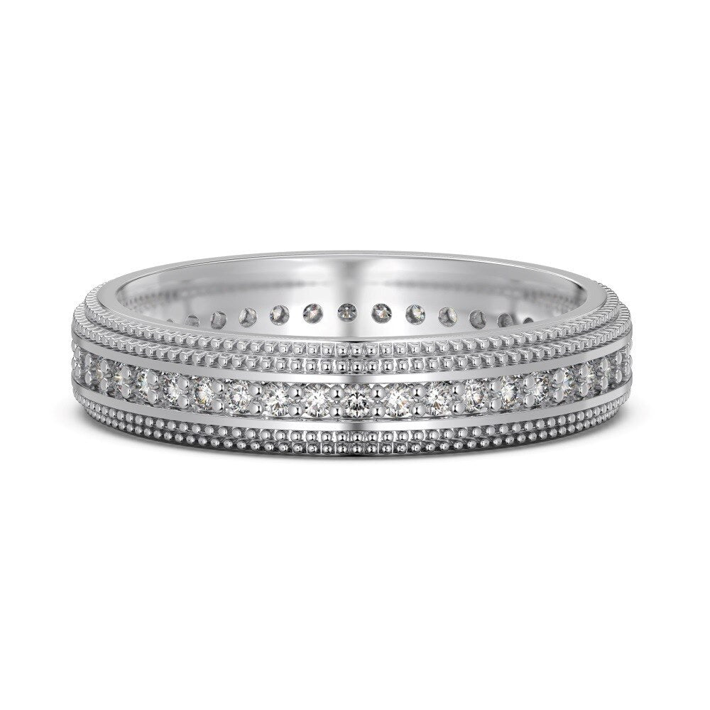 Silver ring with diamond accents on a white background