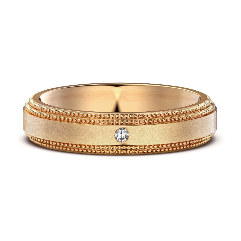 Gold ring with a diamond on a white background