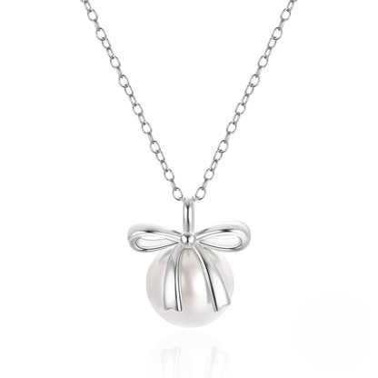 Silver necklace with a bow-shaped pendant on a white background