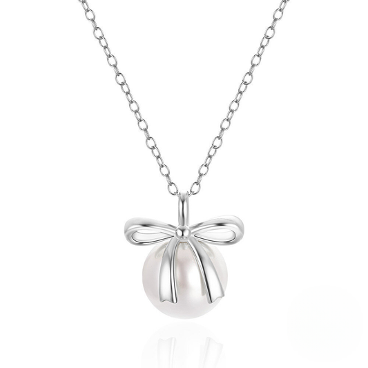 Silver necklace with a bow-shaped pendant on a white background