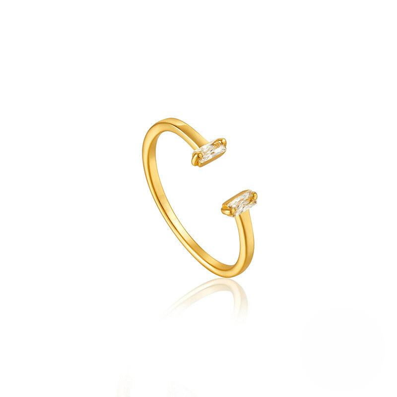 Gold open ring with small diamonds on a white background