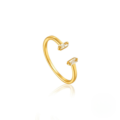 Gold open ring with small diamonds on a white background